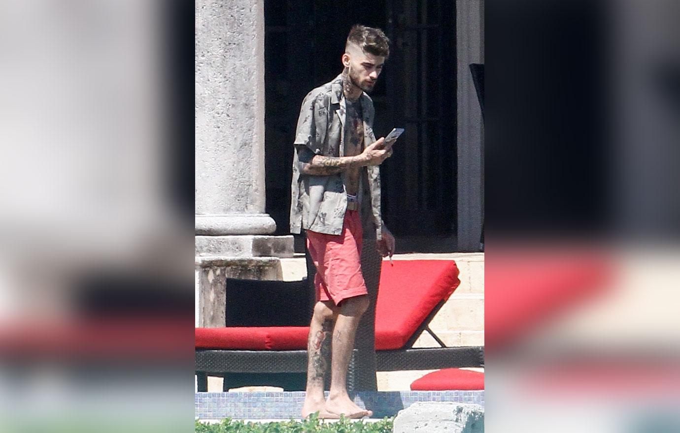 Zayn Malik looks extremely thin as he chain smokes by the pool after split from Gigi Hadid