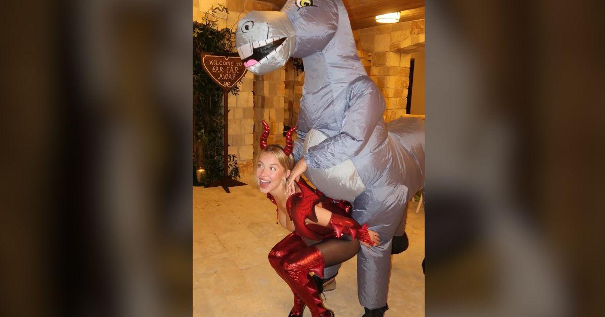 image of Sydney Sweeney had a plastic donkey riding on her back at the bash.