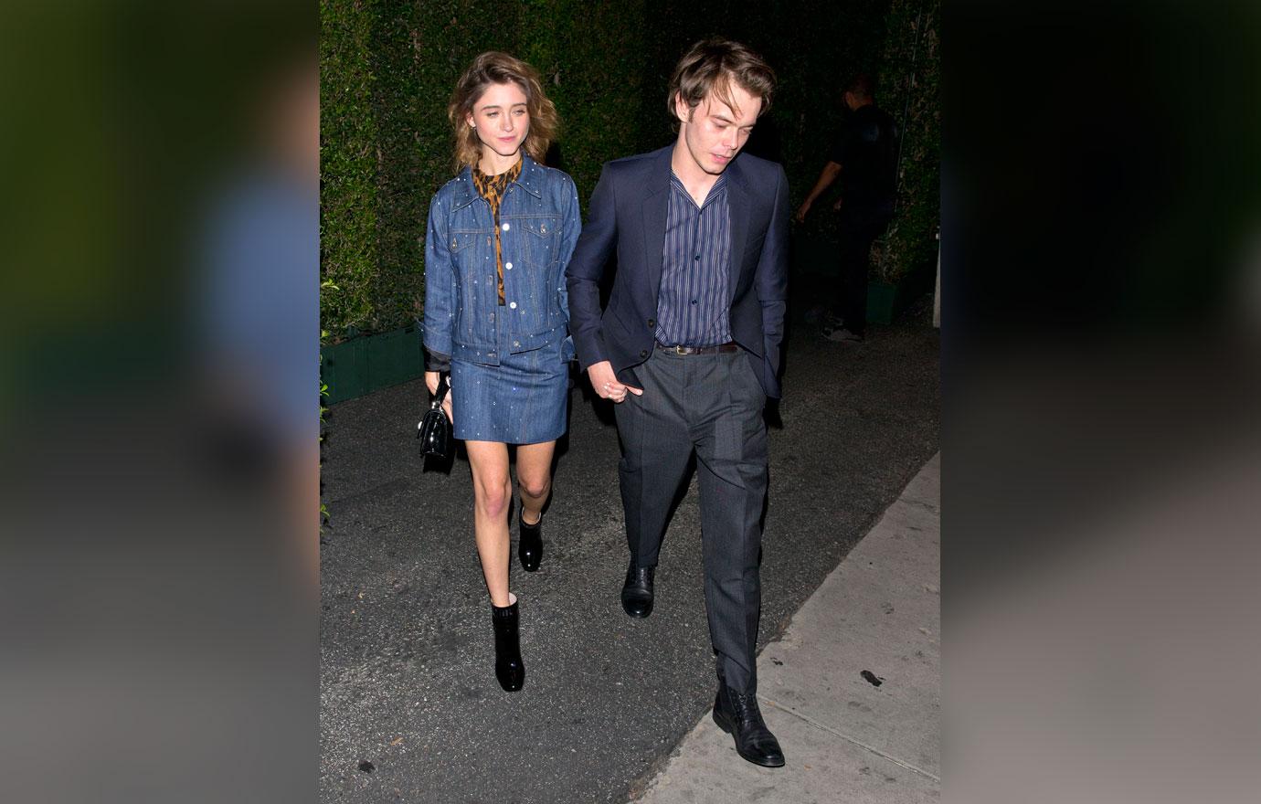 Natalia Dyer and Charlie Heaton hold hands as they leave the &#8216;MIU MIU&#8217; clothing launch in West Hollywood, CA