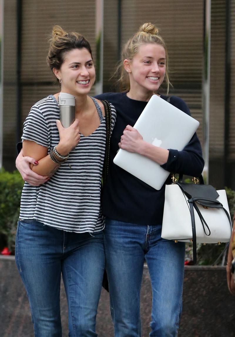 EXCLUSIVE: **PREMIUM RATES APPLY** Amber Heard all smiles following four hour meeting with her legal team in Los Angeles