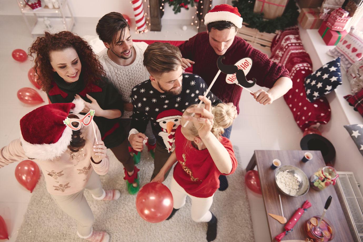 Overhead view of young adult friends dancing at christmas party