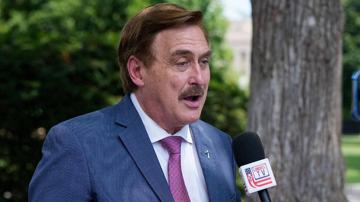 image of Donald Trump ally Mike Lindell was served papers while on live TV. 