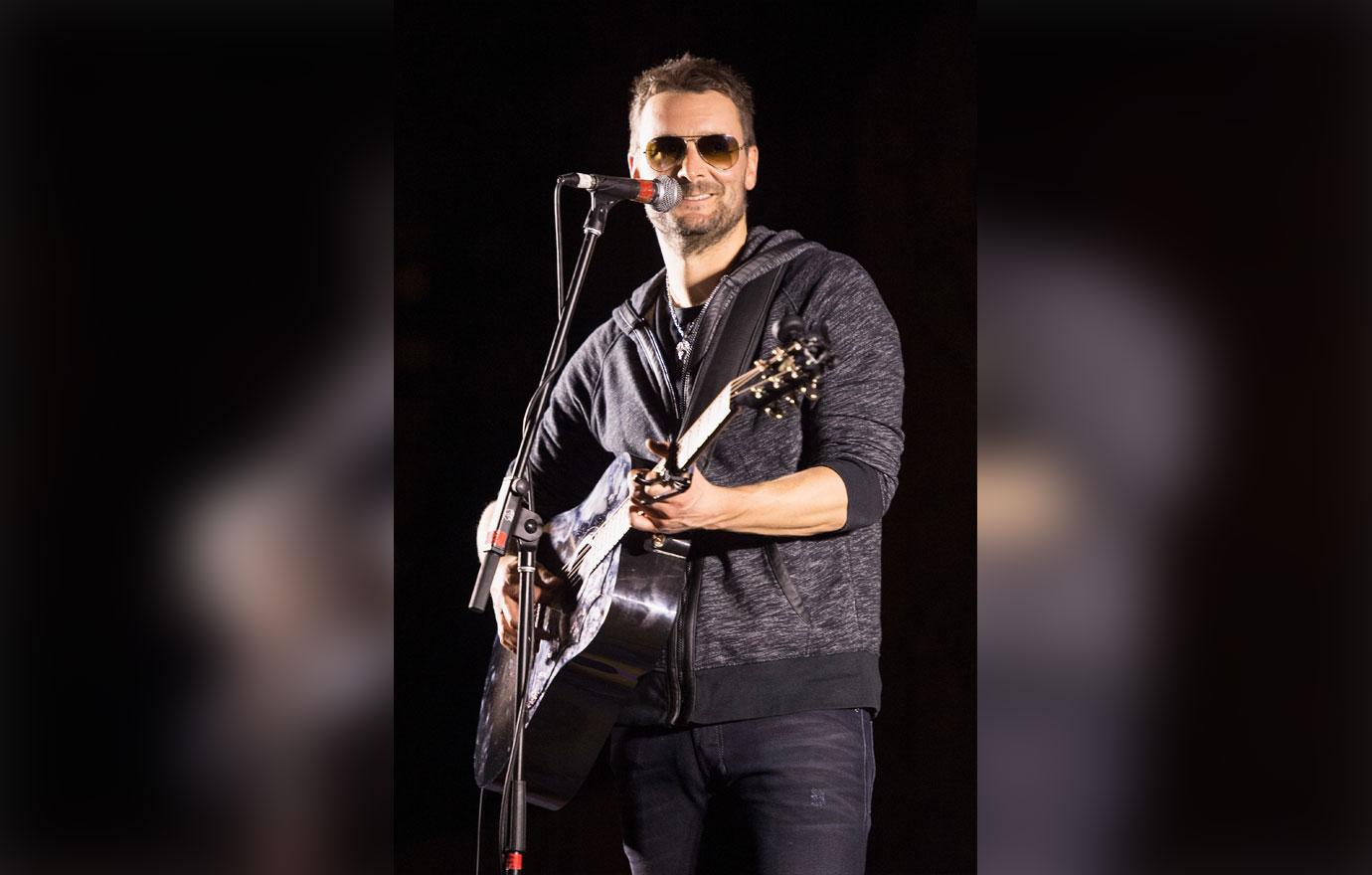 eric church in sweatshirt onstage