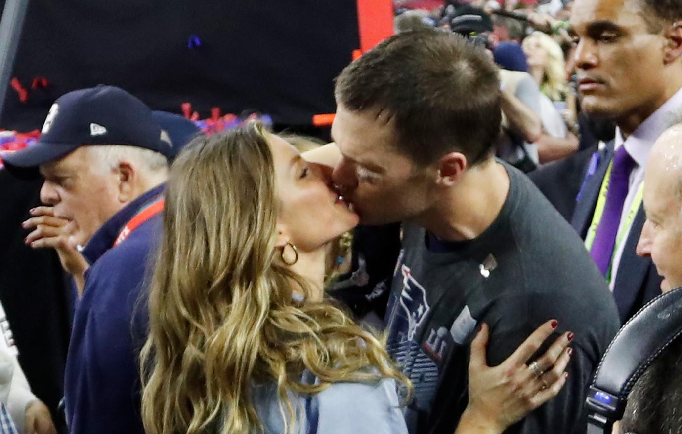 Merry Christmas from Hollywood! Gisele gets a kiss from Tom Brady