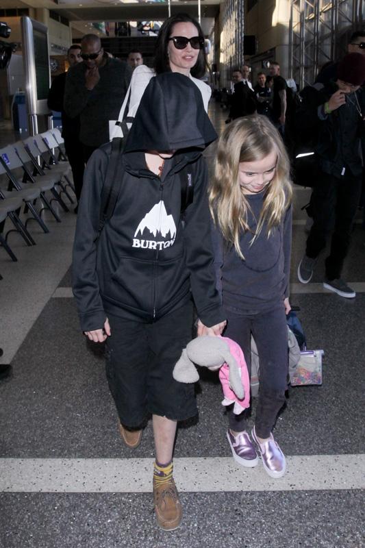 Angelina Jolie makes sure her kids are all in line at LAX