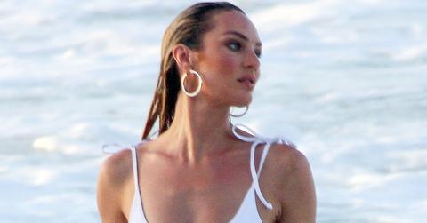 *EXCLUSIVE* Pregnant Candice Swanepoel mesmerizes in white one piece!