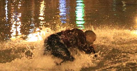 Kanye West jumps into water as fans, cops, jump in along with the soaking wet rapper at last minute concert in Armenia as Kim Kardashian watches him