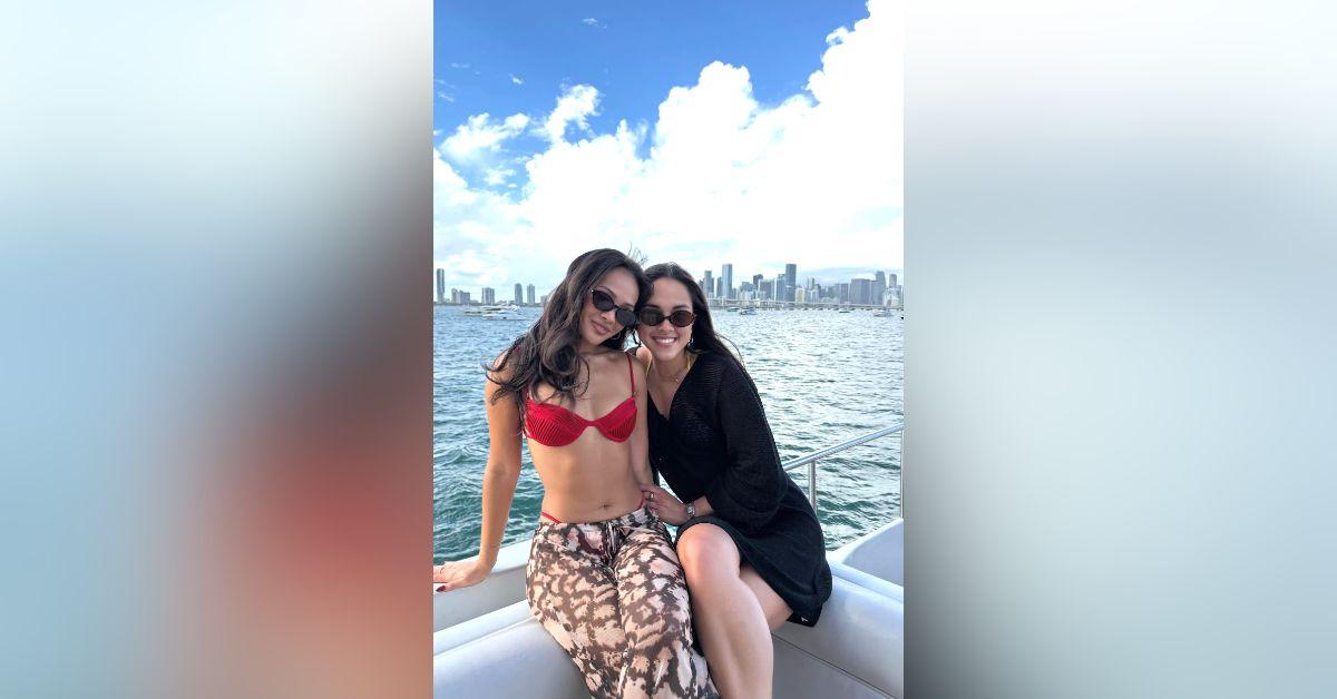 Image of Jenn Tran soaked in the sun on a boat with her friends.