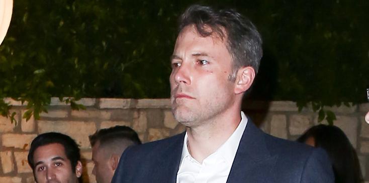 A somber looking Ben Affleck leaves a pre Oscar party