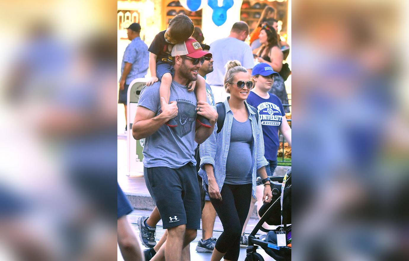 EXCLUSIVE: Carrie Underwood and Mike Fisher take their son on his first trip to Disneyland