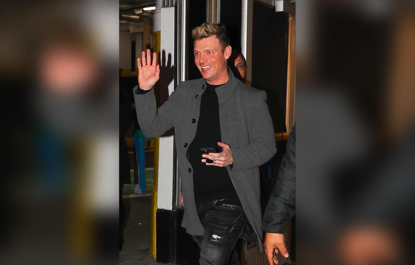 nick carter big smile denying sexual assault allegations