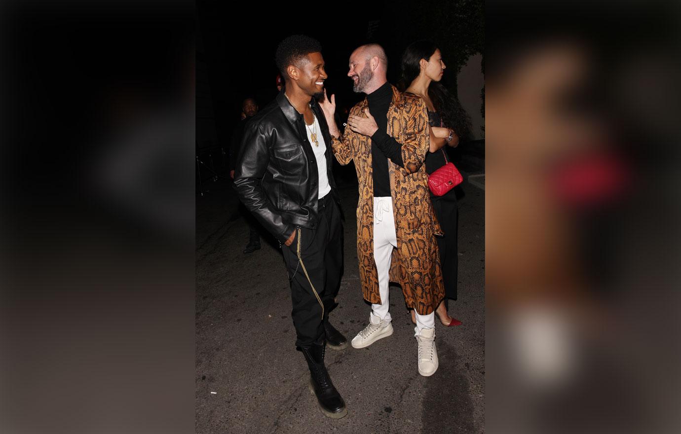 Usher is seen leaving Ysabel restaurant with two female companions after attending P Diddy&#8217;s 49th birthday party