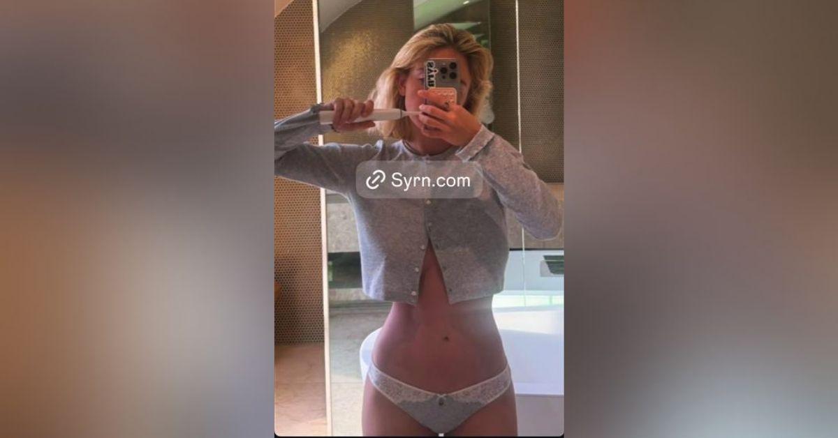 image of Sydney Sweeney shared a sultry mirror selfie while posing in lace underwear and a cropped cardigan.