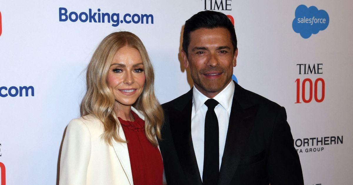 image of Kelly Ripa uses her retainer as a signal to tell Mark Consuelos she's going to bed. 