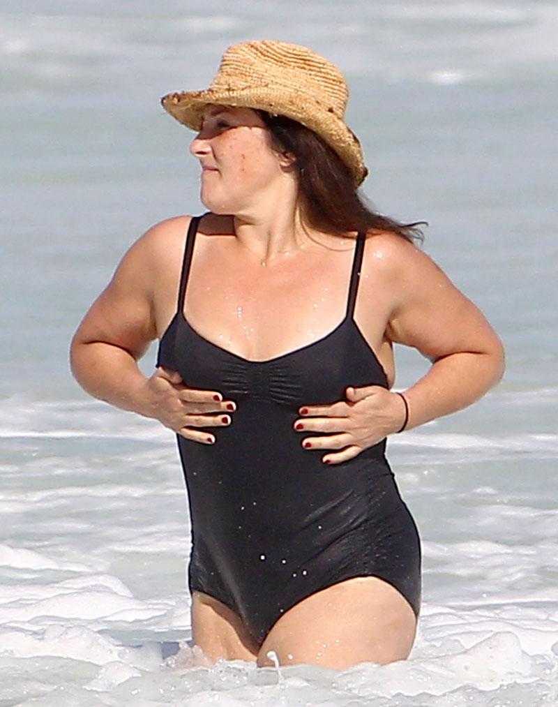 Ouch! Ricki Lake Struggles With Her Tight Bathing Suit While In