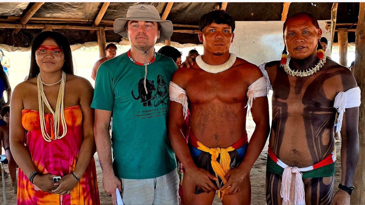 Image of DiCaprio with Indigenous leaders in Brazil.