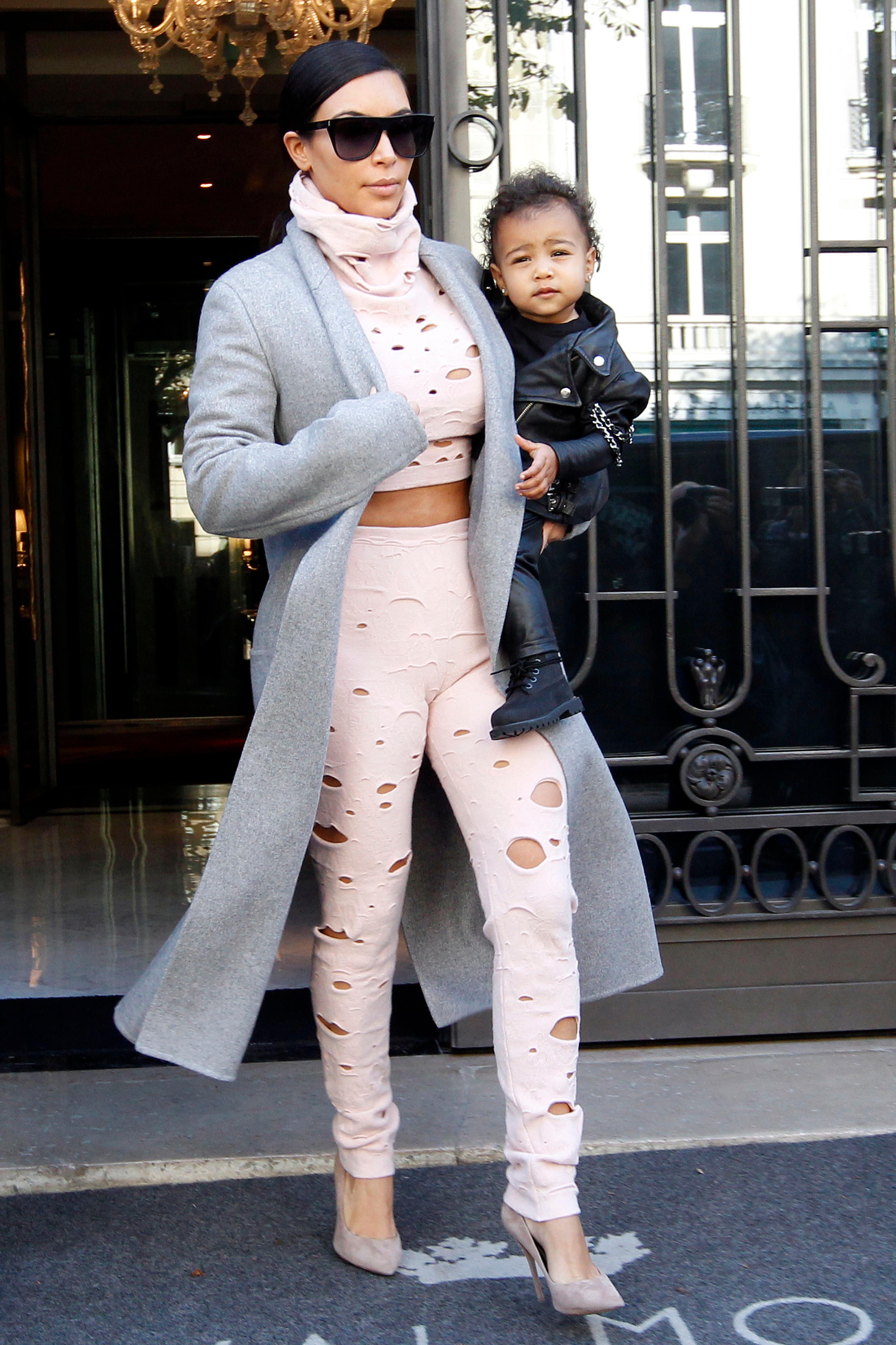 Kim Kardashian heads out for the airport with daughter North West in Paris