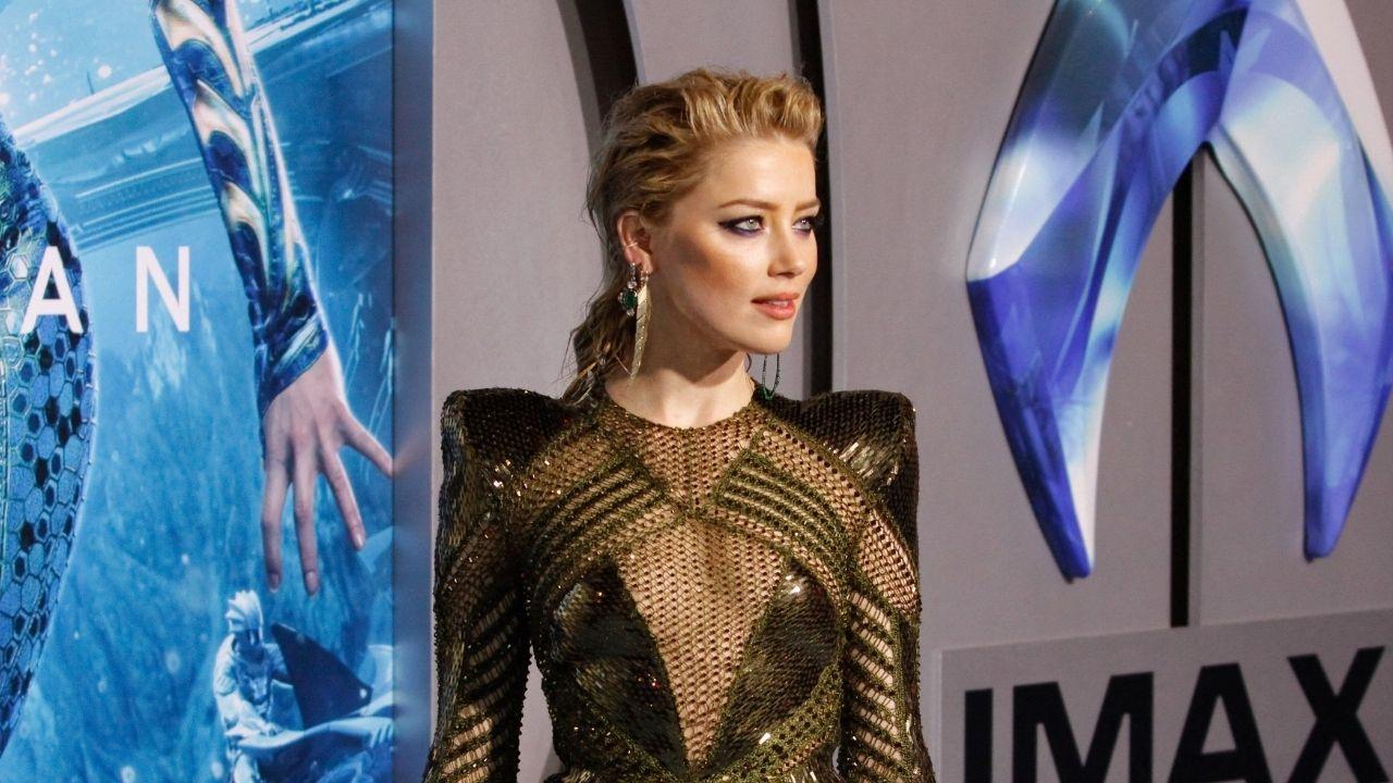 image of Amber Heard also shared a tender moment with her 5-year-old daughter, Oonagh, after crossing the finish line.