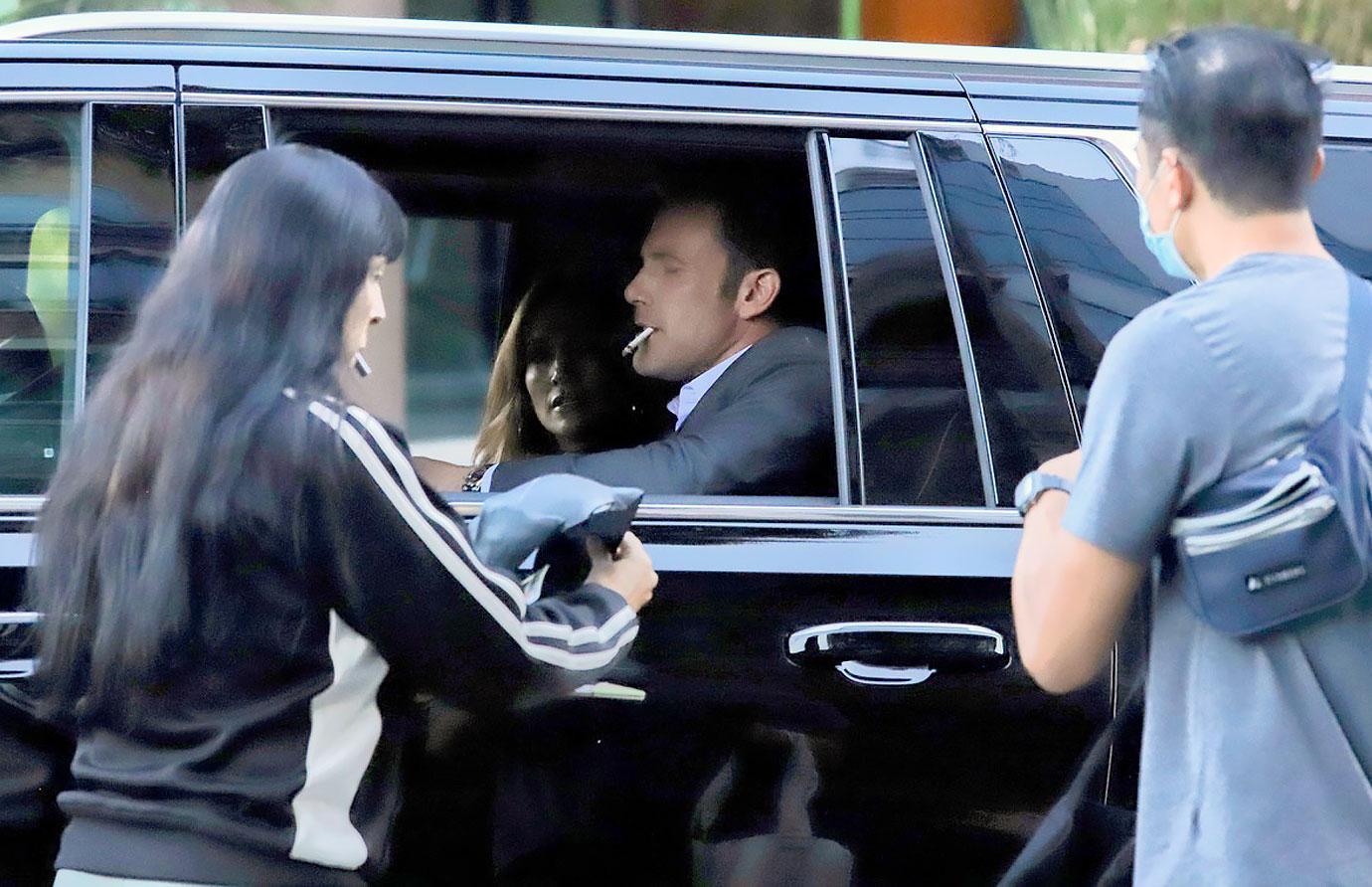 ben affleck smokes cigarette signs autographs at a red light while leaving the tender bar premiere jennifer lopez