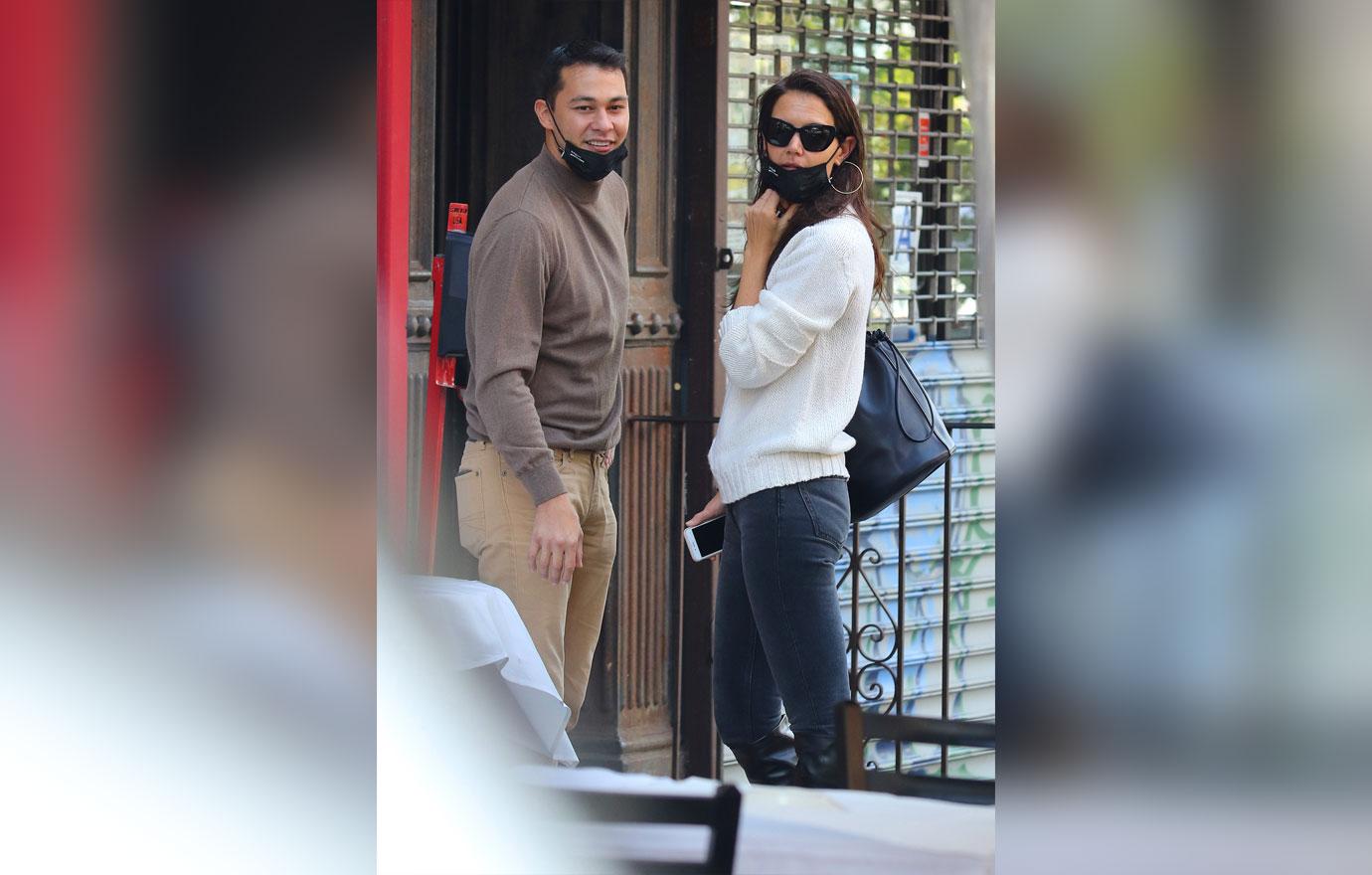 Katie Holmes and boyfriend Emilio Vitolo Jr. are all smiles as they continue another steamy make-out session outside his restaurant in NYC