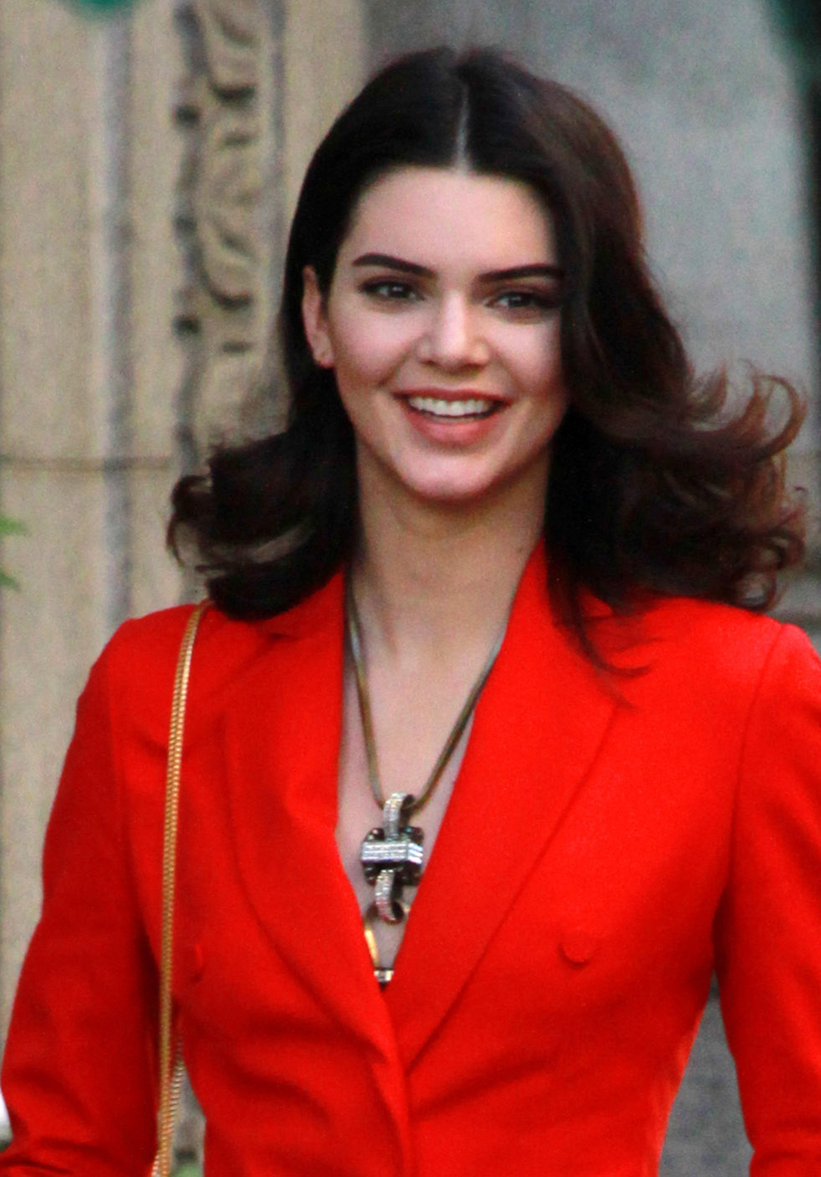 Kendall Jenner seen in a red suit for a photo shoot