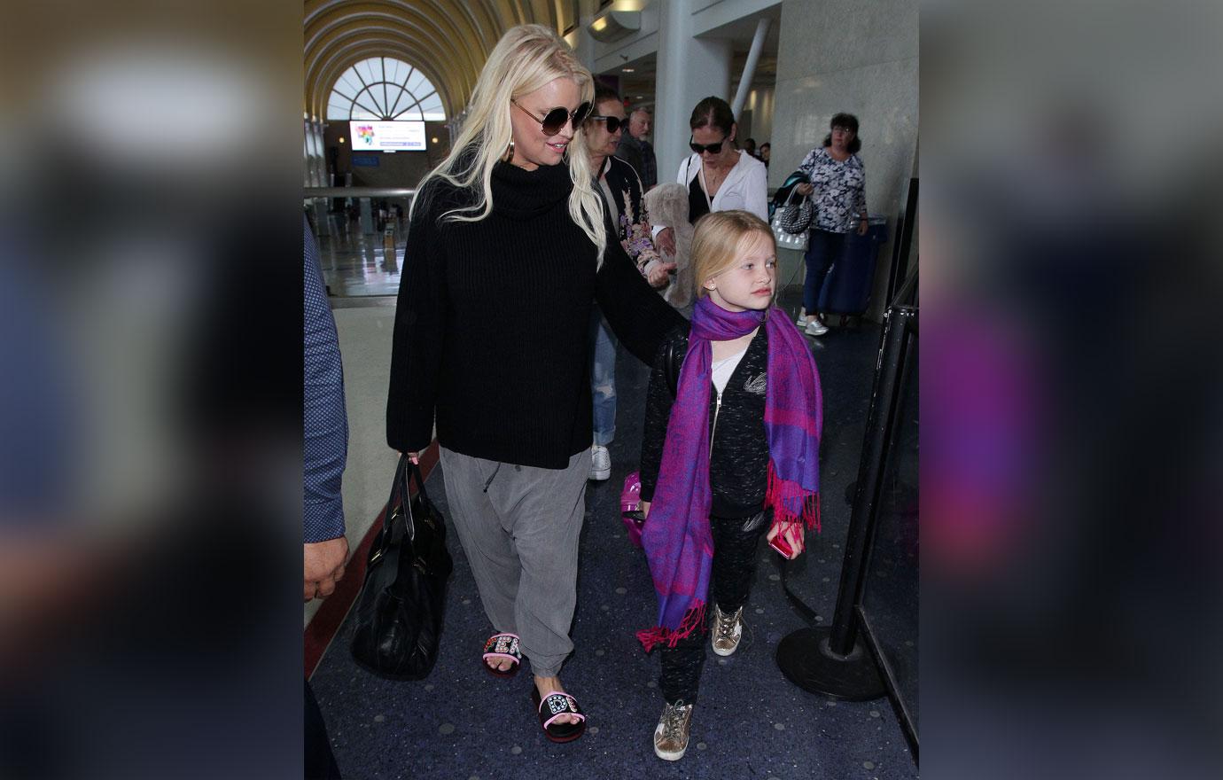 Jessica Simpson and family arriving at the Los Angeles International Airport