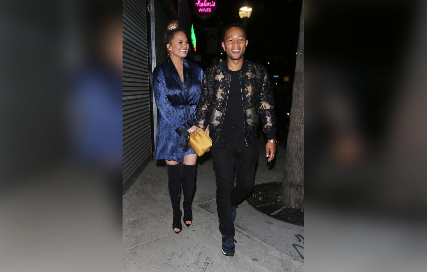 Chrissy Teigen and John Legend walk hand in hand as they exit Jon &amp; Vinny&#8217;s restaurant after dining with friends