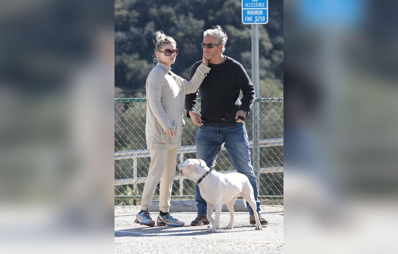 *EXCLUSIVE* Joanna Krupa packs on the PDA on an outing to the dog park with a mystery man