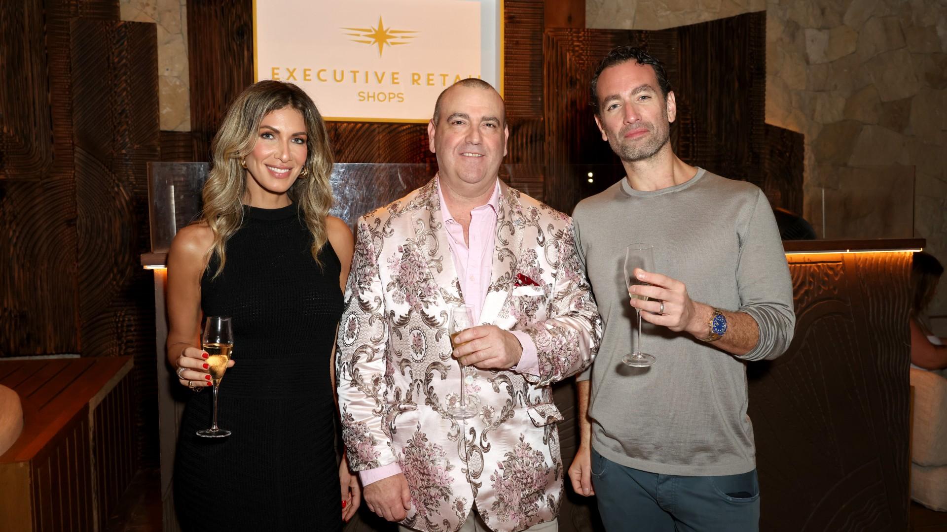 Photo of Erin Lichy, Abe Lichy and Executive Retail Shops’ President James Mullaney. 