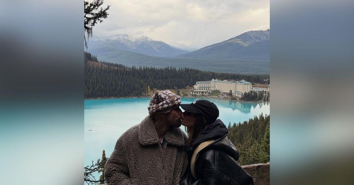 image of The couple shared sweet kisses and laughs by Lake Louise.