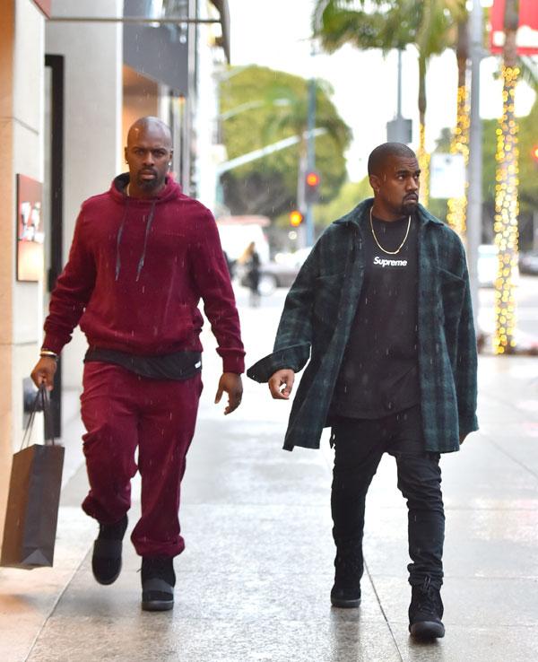 Corey Gamble carries a Hermes shopping bag on Rodeo Drive