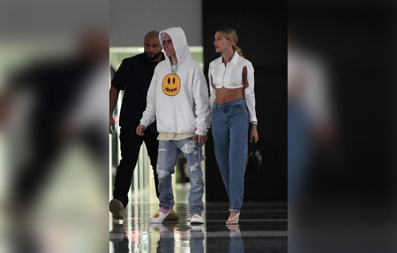 Justin and Hailey Bieber hold hands as they leave dinner at Komodo in Miami