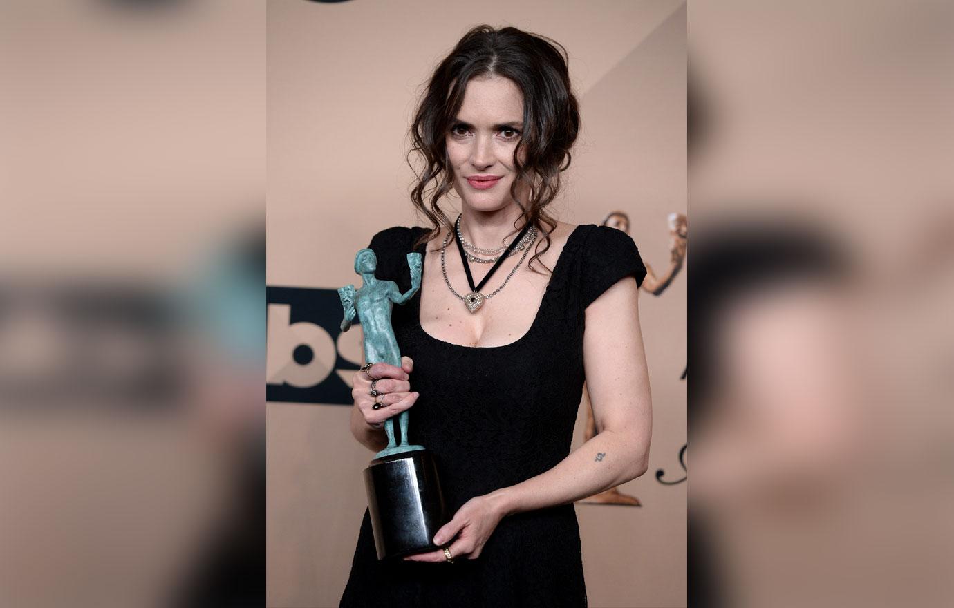 Winona Ryder with award