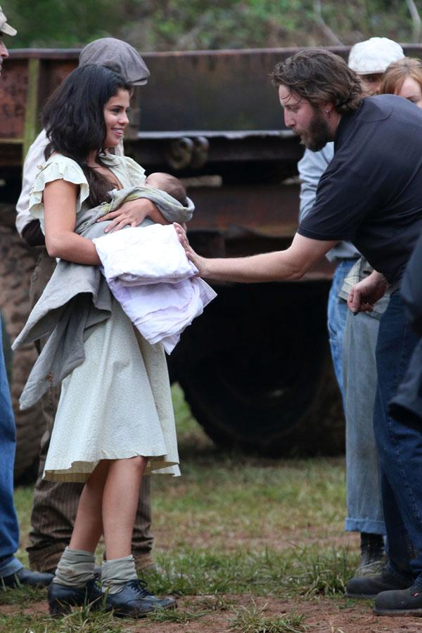 Selena Gomez Holds Baby On Set