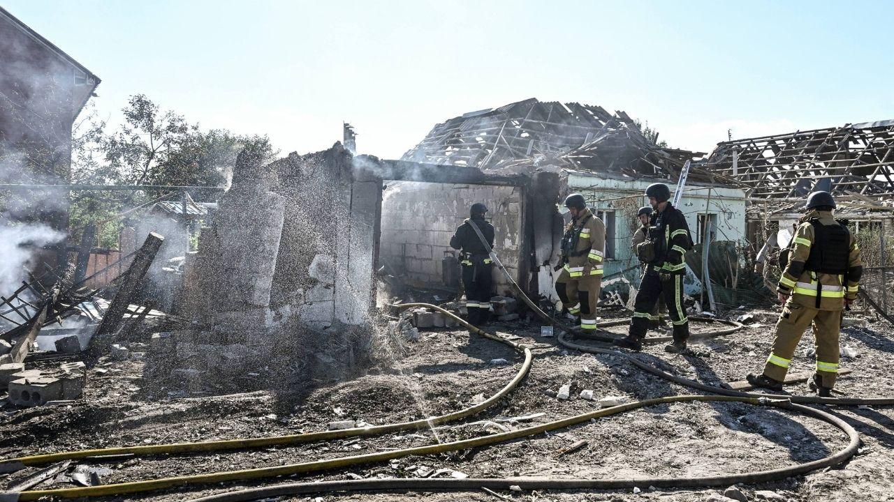 Image of Ukrainian rescue workers confront the devastation left by Russia's ongoing attacks.