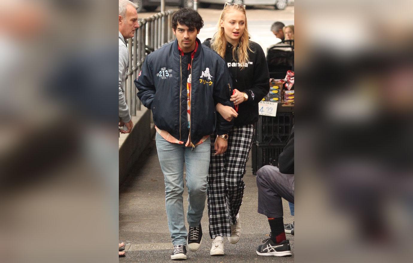 EXCLUSIVE: Joe Jonas and Sophie Turner share a kiss as they leave a Bondi cafe