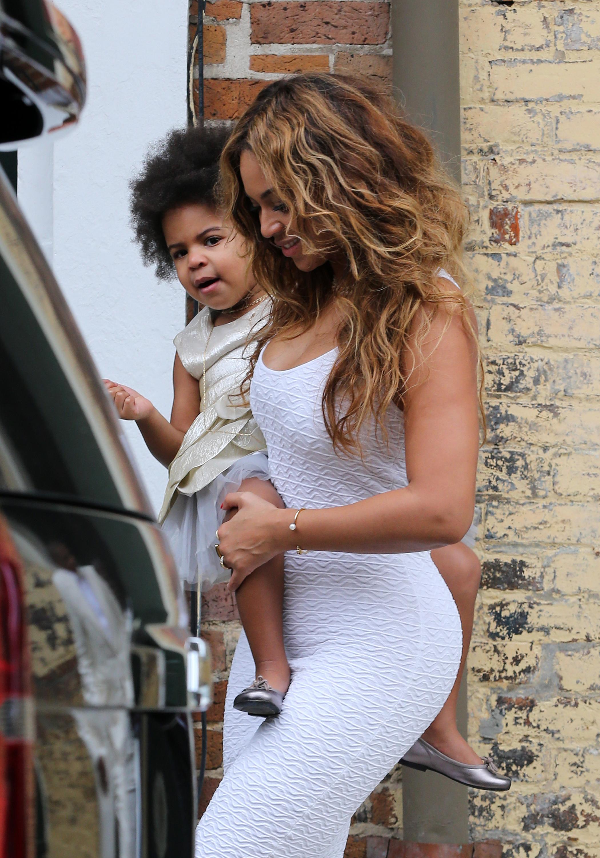 Beyonce, Jay Z and Blue Ivy dressed all in white leave for Solange Knowles wedding