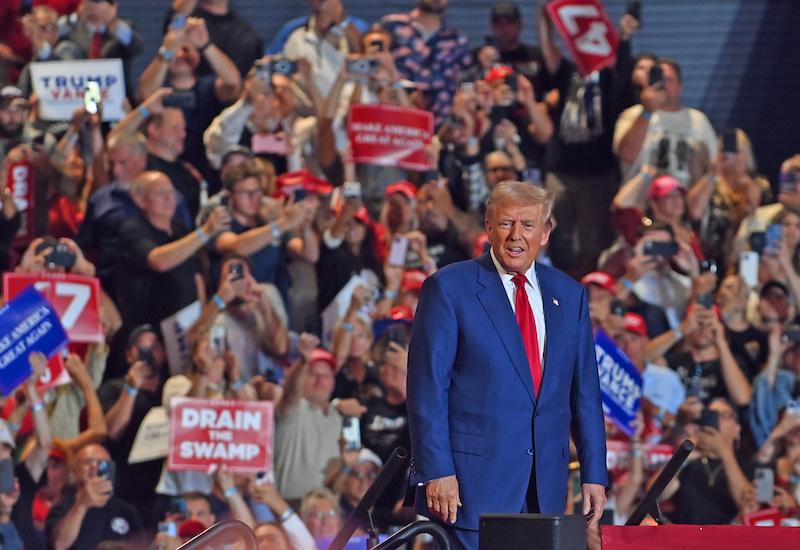 donald trump petting woman side head