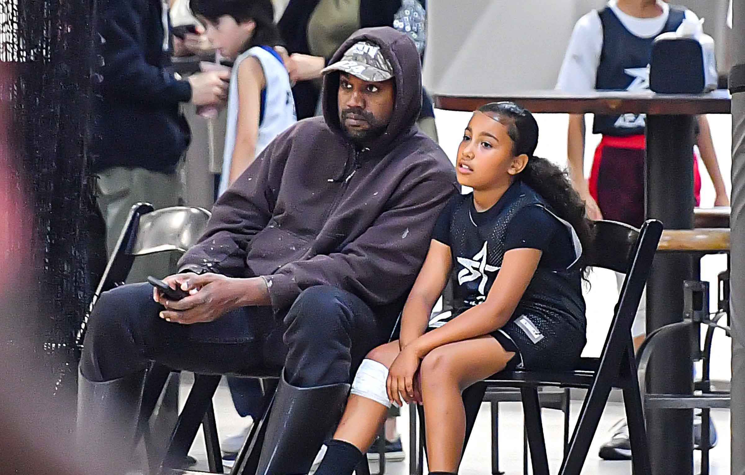 Kanye West is BOOED at Super Bowl LVI as he attends game with children  North, 8, and Saint, 6