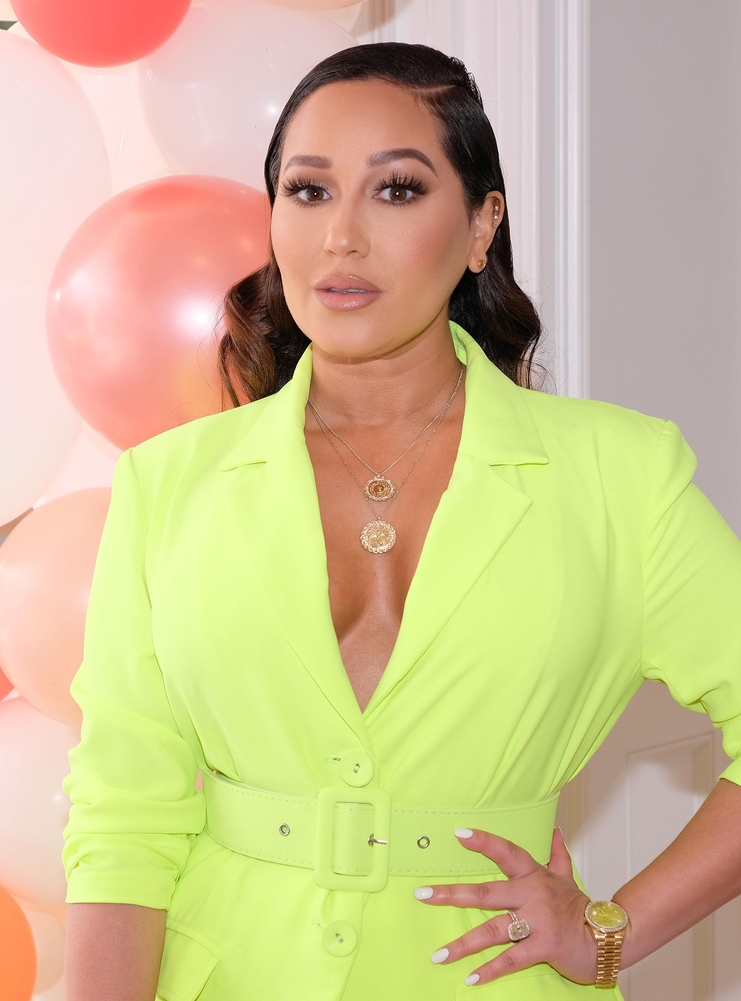 Adrienne Bailon Shows Off Her Figure In Bikini Photoshoot