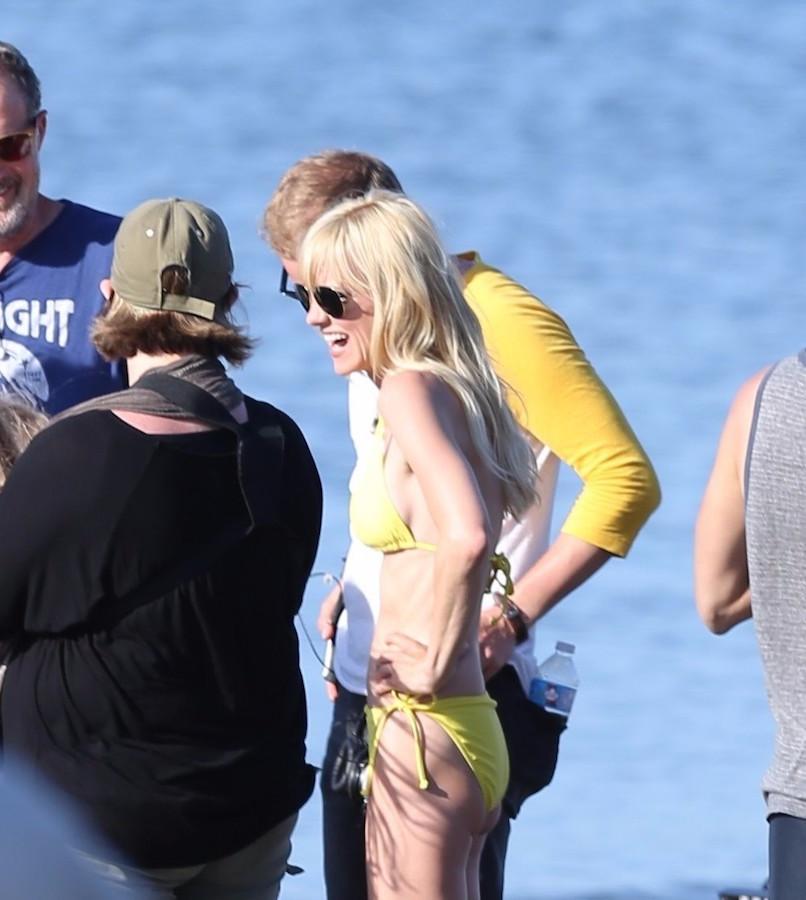 Anna Faris goes for a dip in a tiny yellow bikini on the set of &#8216;Overboard&#8217;