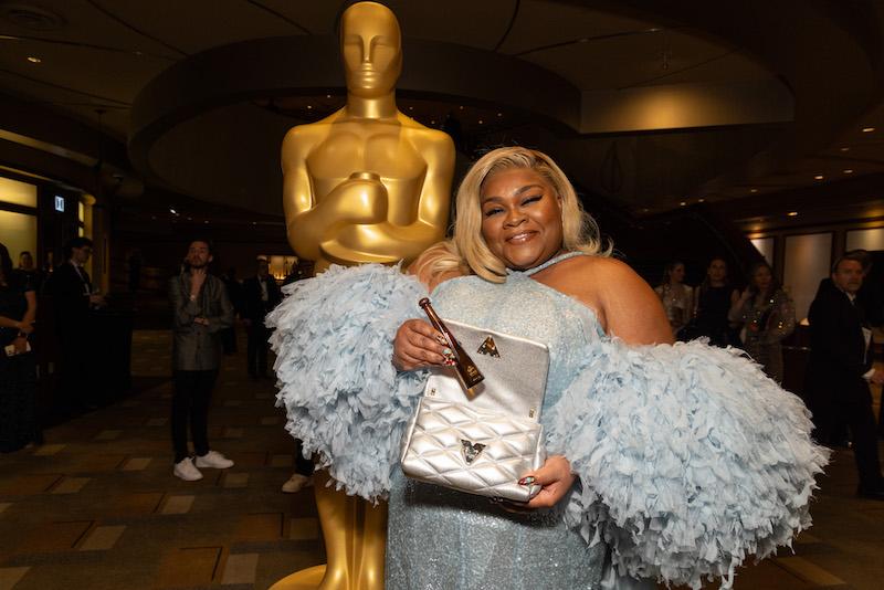 davine joy randolph gets in the celebratory spirit with tequila don julio  as she walks the red carpet for the th annual oscars ceremony