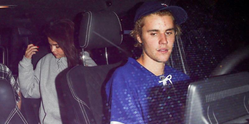 Selena Gomez and Justin Bieber leaving hockey game in a car