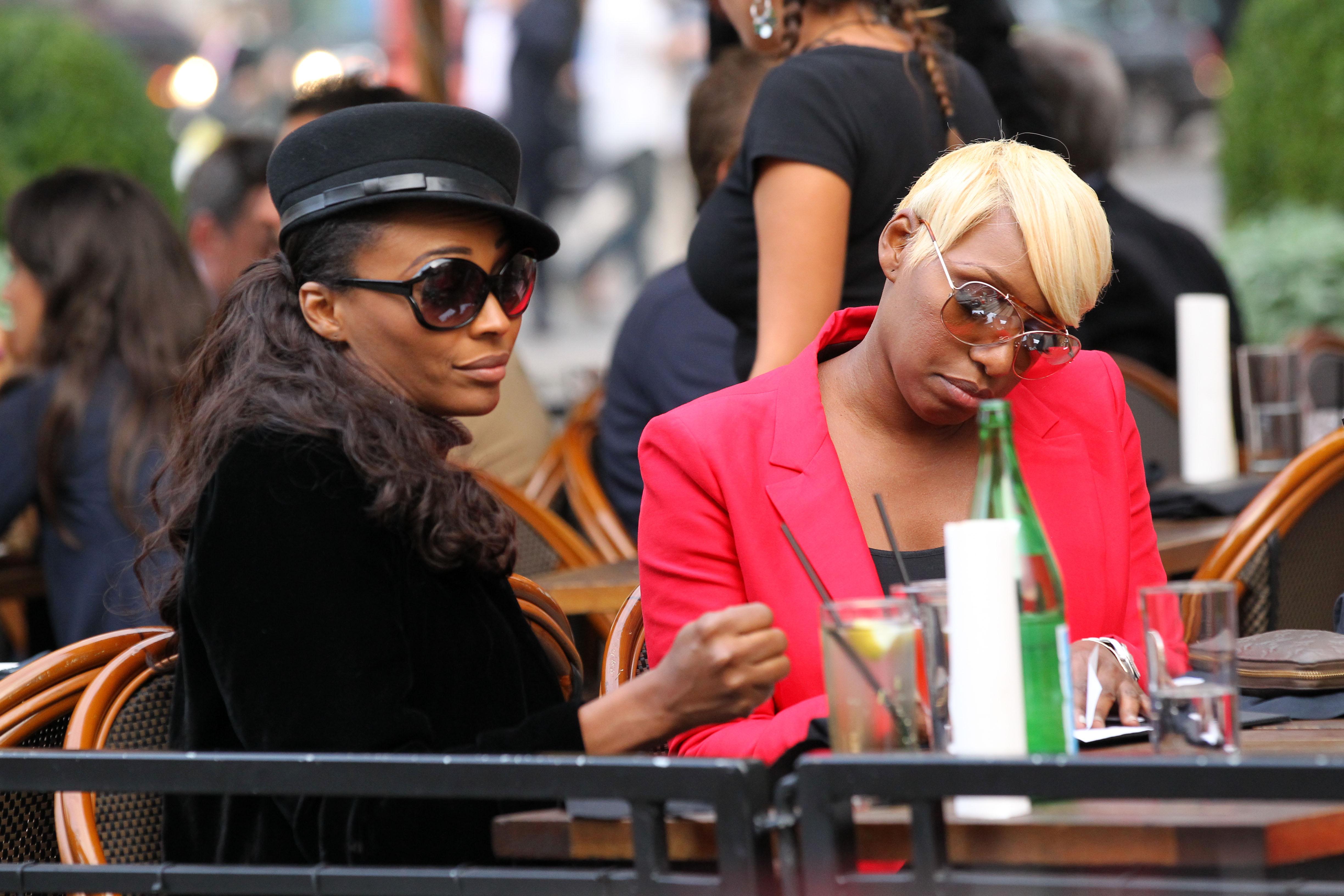 TV personality NeNe Leakes from &#8216;The Real Housewives at Atlanta&#8217; picks up the check at Dos Caminos for her co star Cynthia Bailey in New York City