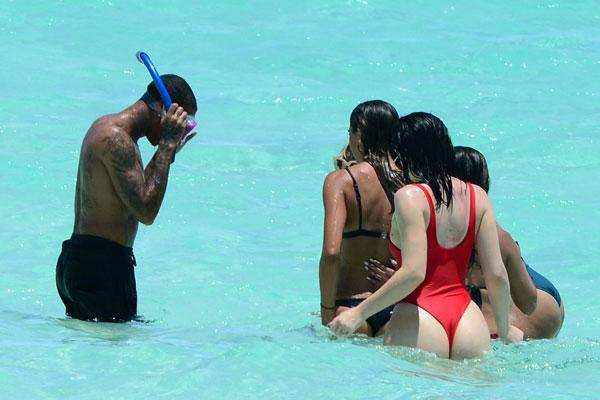 Kylie Jenner Poses in Sexy Louis Vuitton Swimsuit, Parties With Tyga at  Coachella 2016