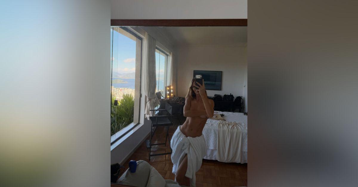 Image of Rosie Huntington-Whiteley wore nothing but a robe around her waist.