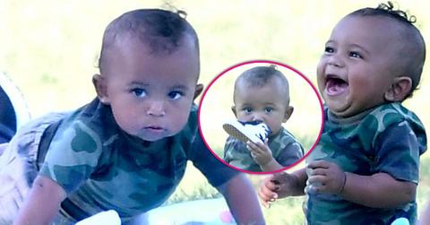 saint west smelling shoe laughing having fun in the park