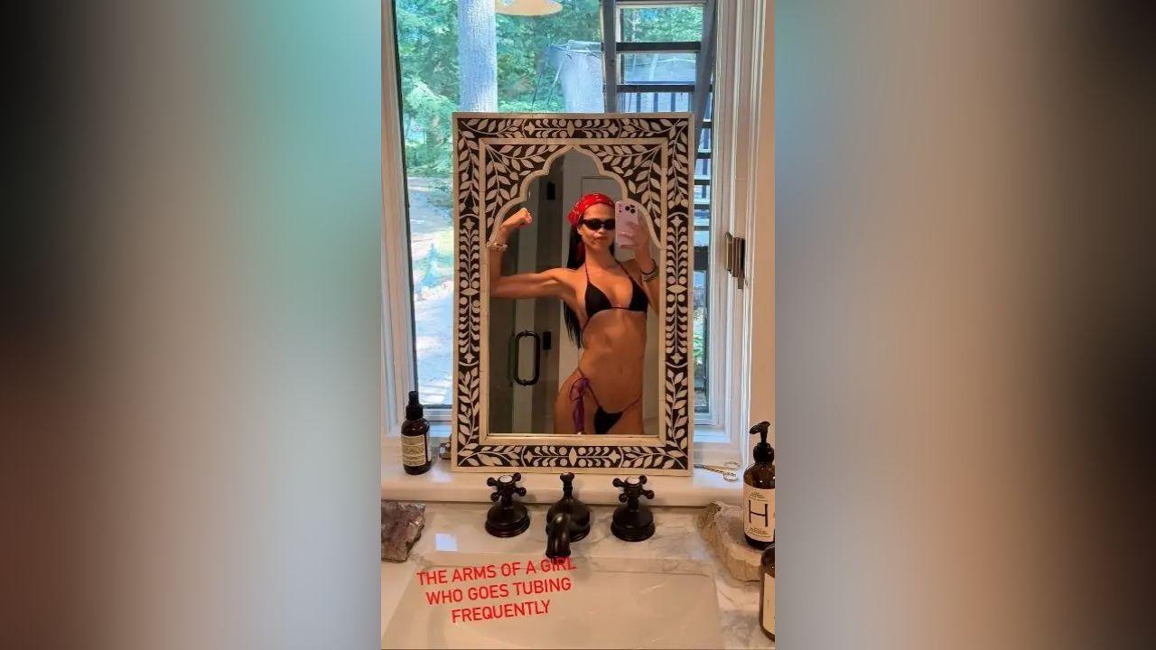 image of Amelia Hamlin wore a red head bandana and black G-string bikini during her lakeside getaway.