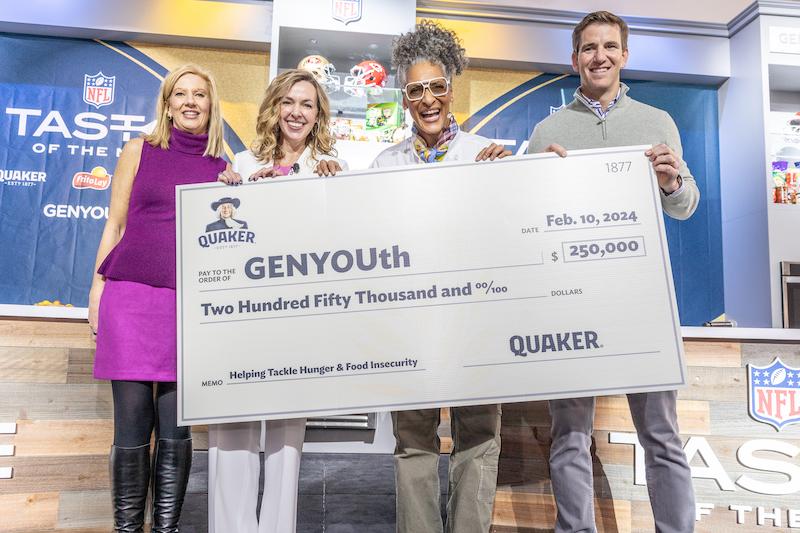 denise truelove senior vice president marketing fritolay north america nd from l celebrity chef carla hall nd from r and nfl legend eli manning helps quaker present  check to genyouth at taste of the nfl presented by frito