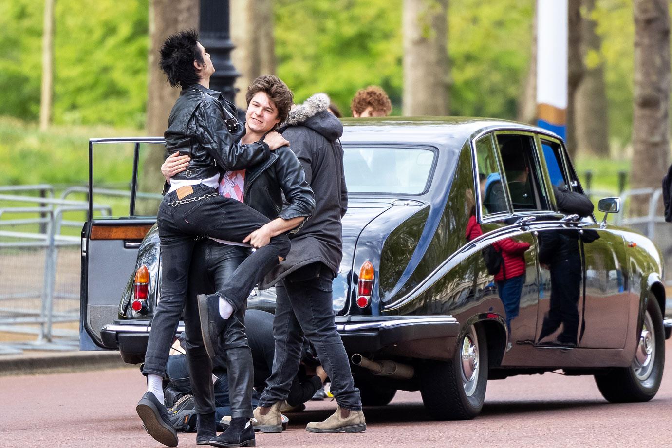 the cast of the new sex pistols film outside buckingham palace ok